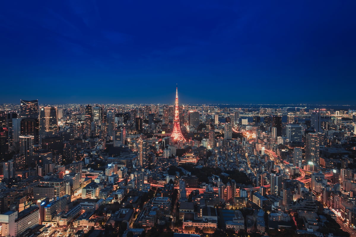 Tokyo skyline at night with Tokyo Tower illuminated, illustrating the Japanese metropolis and urban dynamism