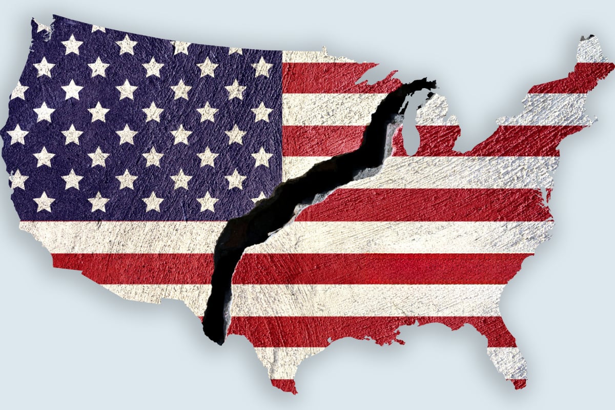 Cracked map of the United States with the American flag, illustrating political and social divisions