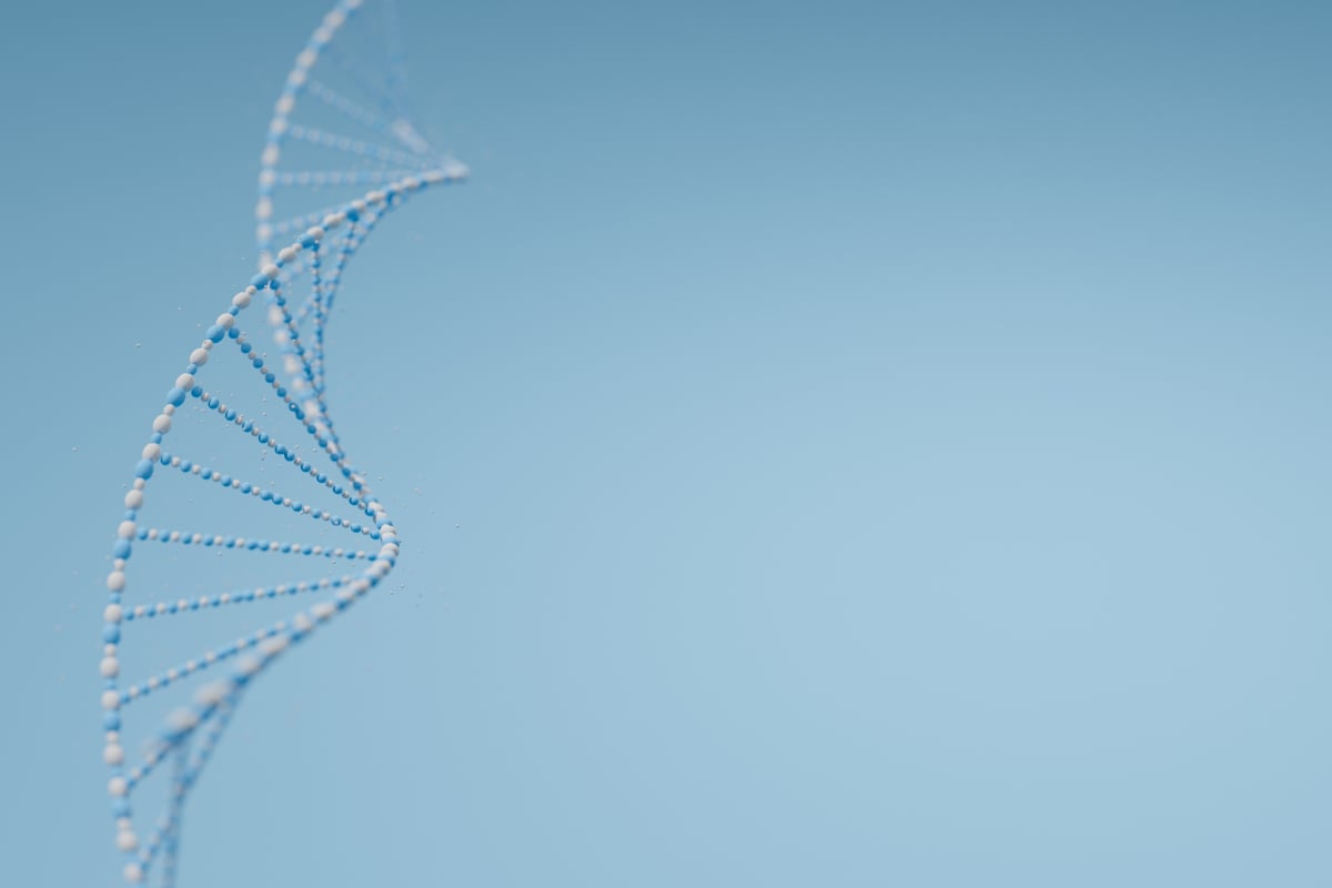 Illustration of a DNA double helix on a soft blue background with ample space for text or graphics.