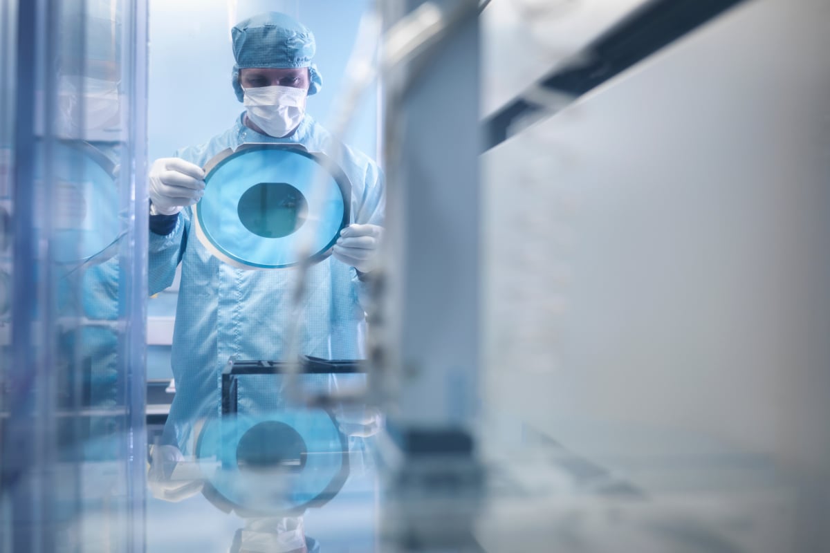 Healthcare professional examining advanced medical imaging in a laboratory focused on oncology and precision medicine innovation