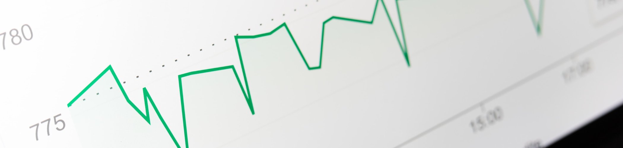 Financial chart with a fluctuating green line, illustrating market trends and volatility