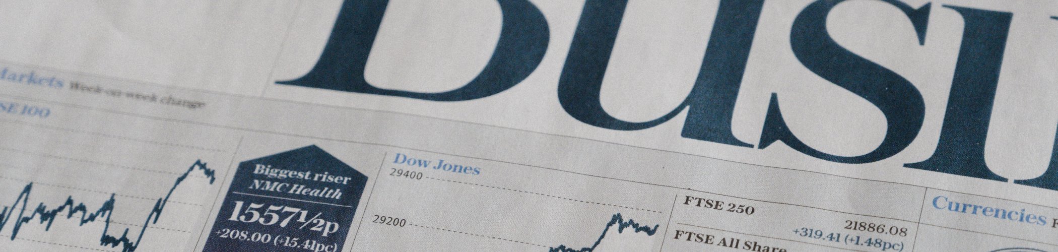 Financial newspaper with stock charts and market data, illustrating economic news and market analysis
