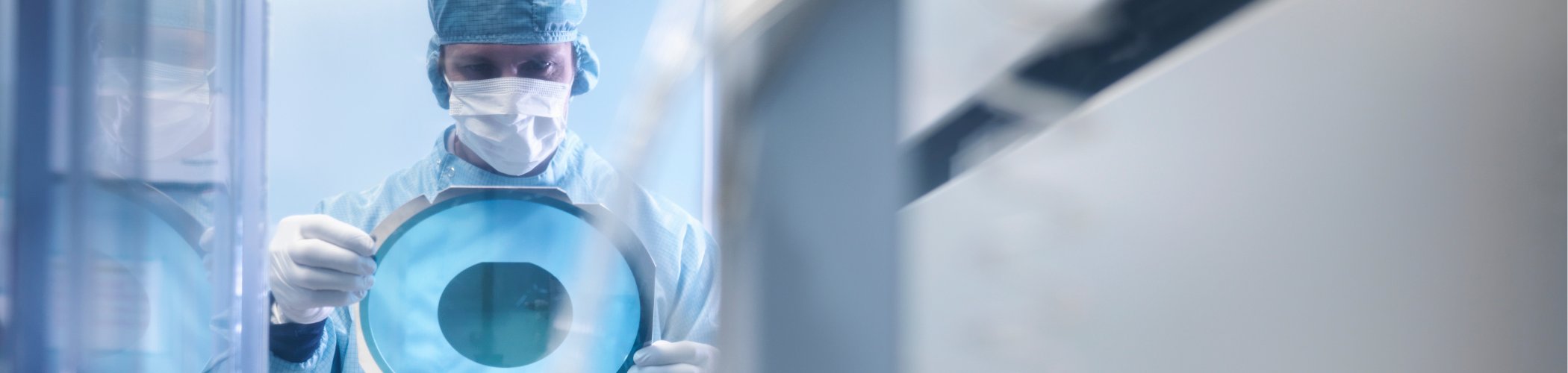 Healthcare professional examining advanced medical imaging in a laboratory focused on oncology and precision medicine innovation