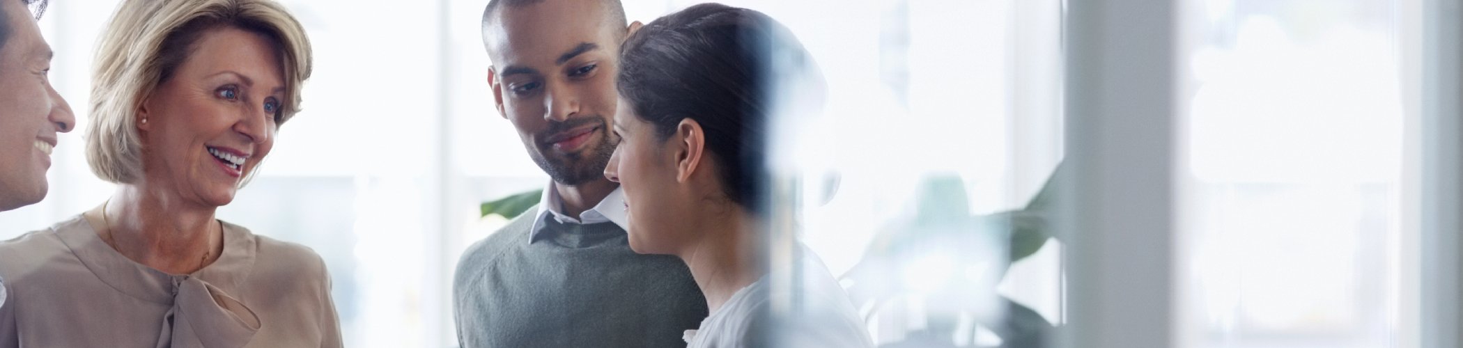Investment professionals exchanging insights and discussing market opportunities in a collaborative business environment